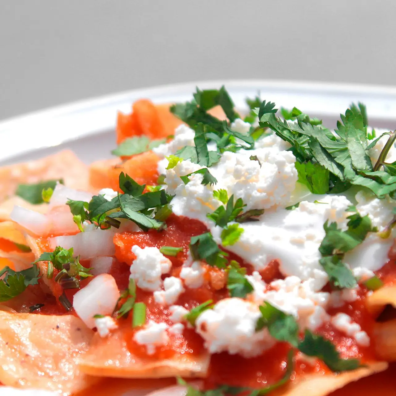 green and red vegetable salad on white ceramic plate